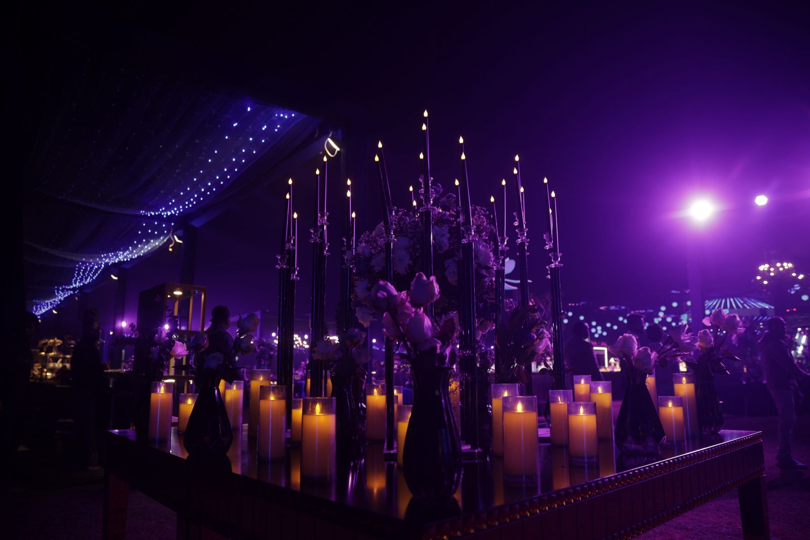 Candlelight and flowers in violet