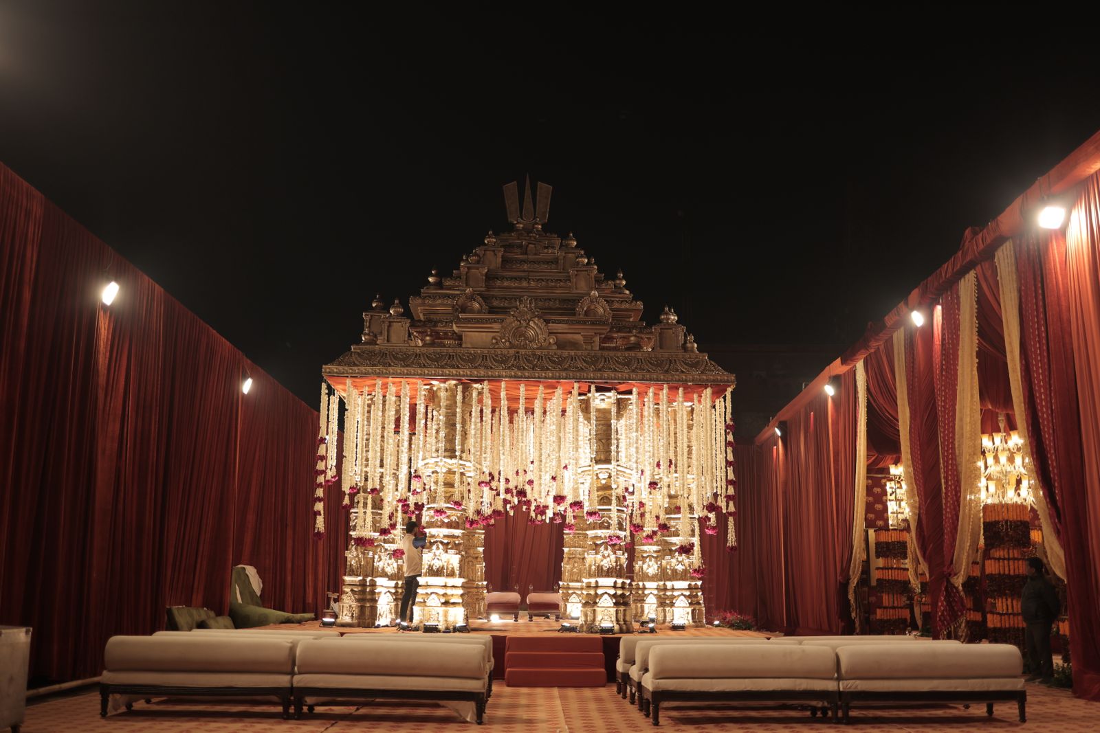 A ceremony stage in ivory and crimson