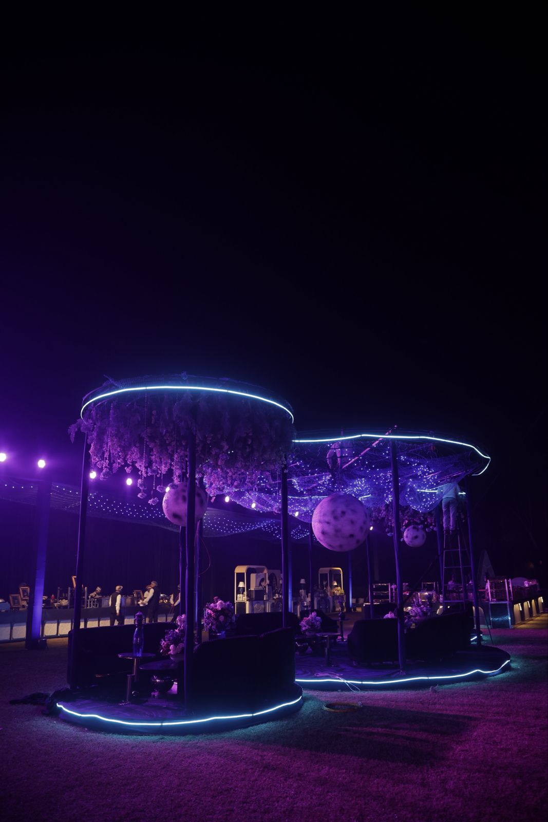 A celestial lounge beneath violet light