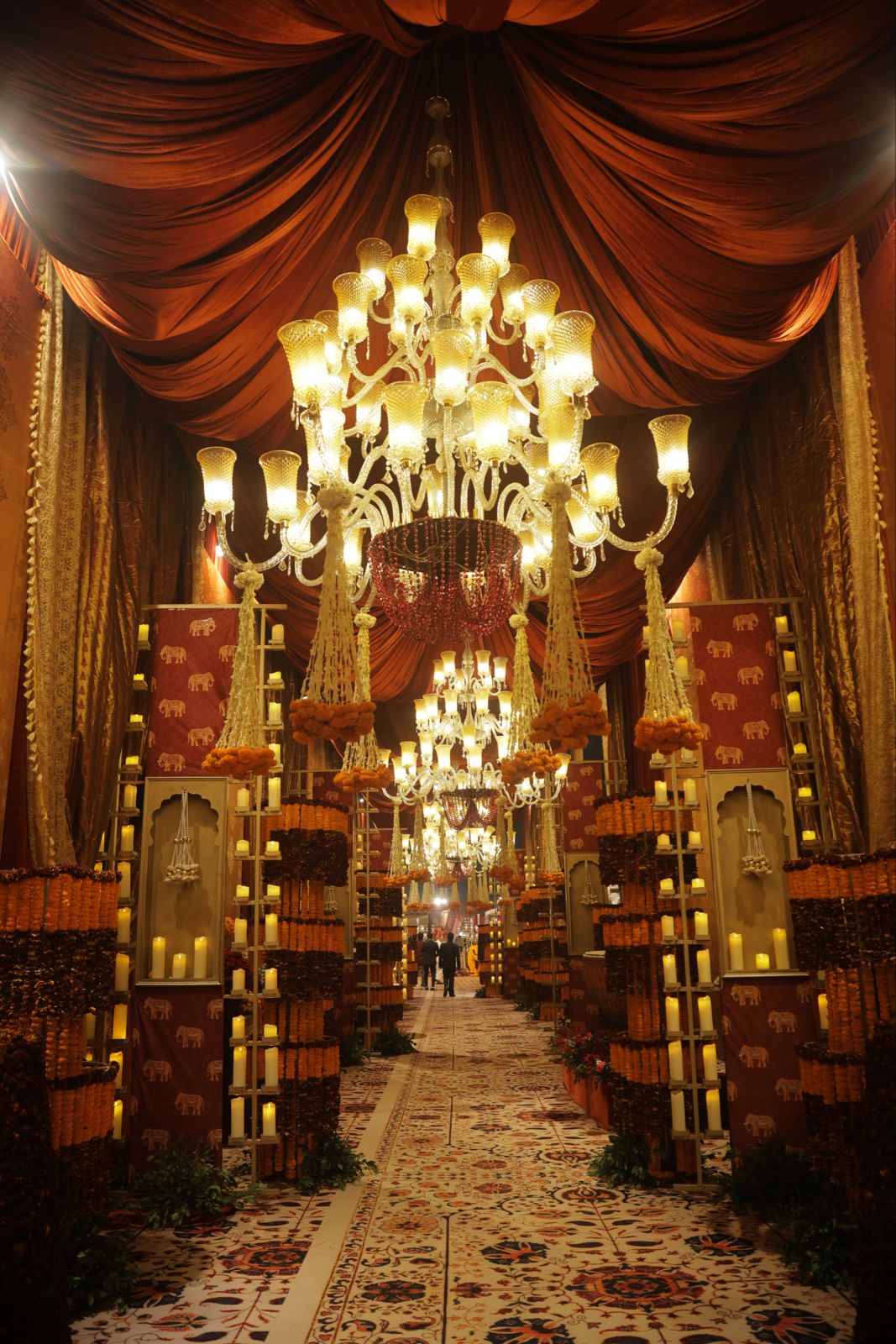 The chandelier aisle in marigold light