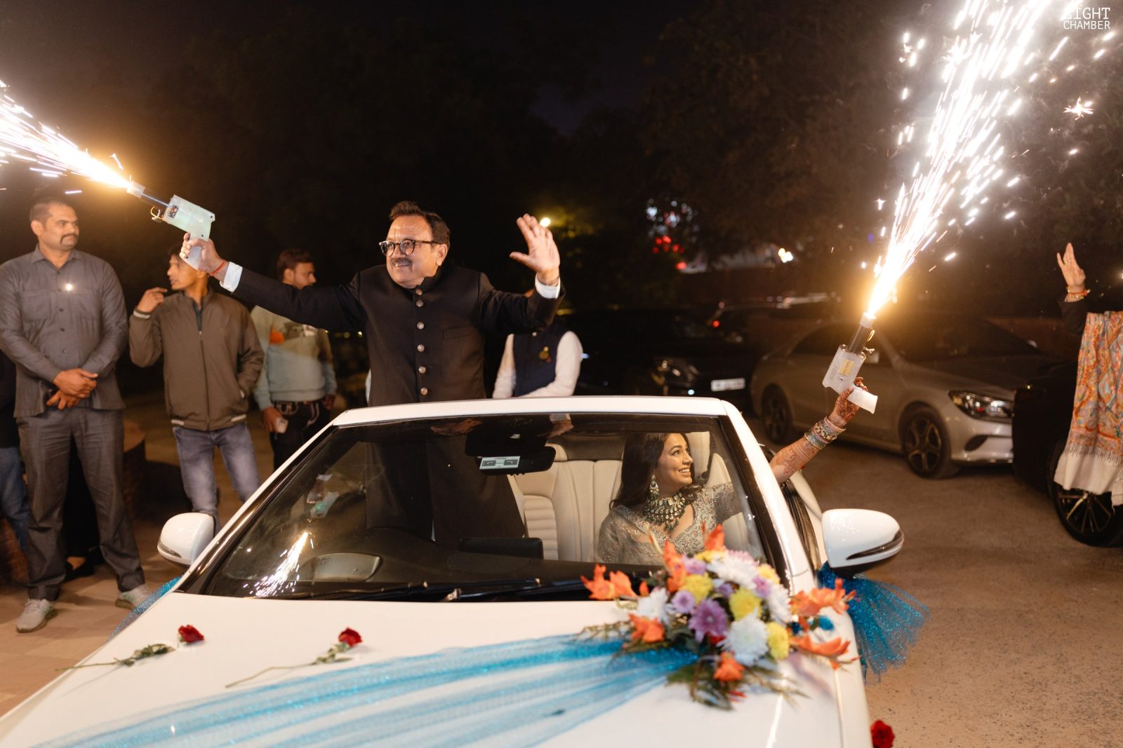 The arrival — a baraat, a decorated vintage car and a flower-lined approach