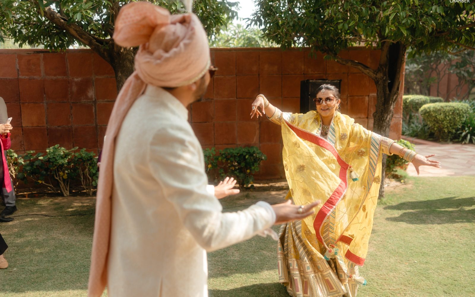 The arrival — a baraat, a decorated vintage car and a flower-lined approach