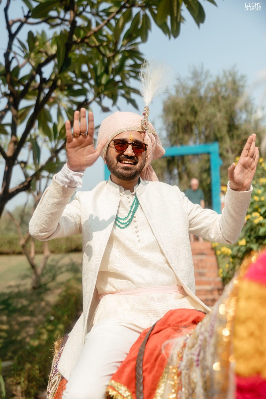 The arrival — a baraat, a decorated vintage car and a flower-lined approach