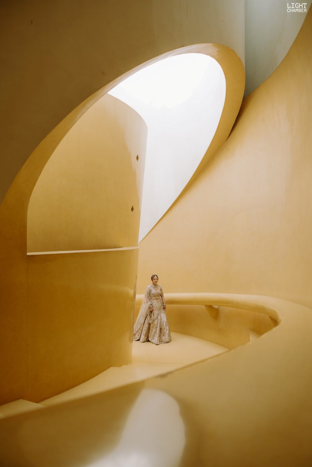 The couple photographed against the architecture of the venue