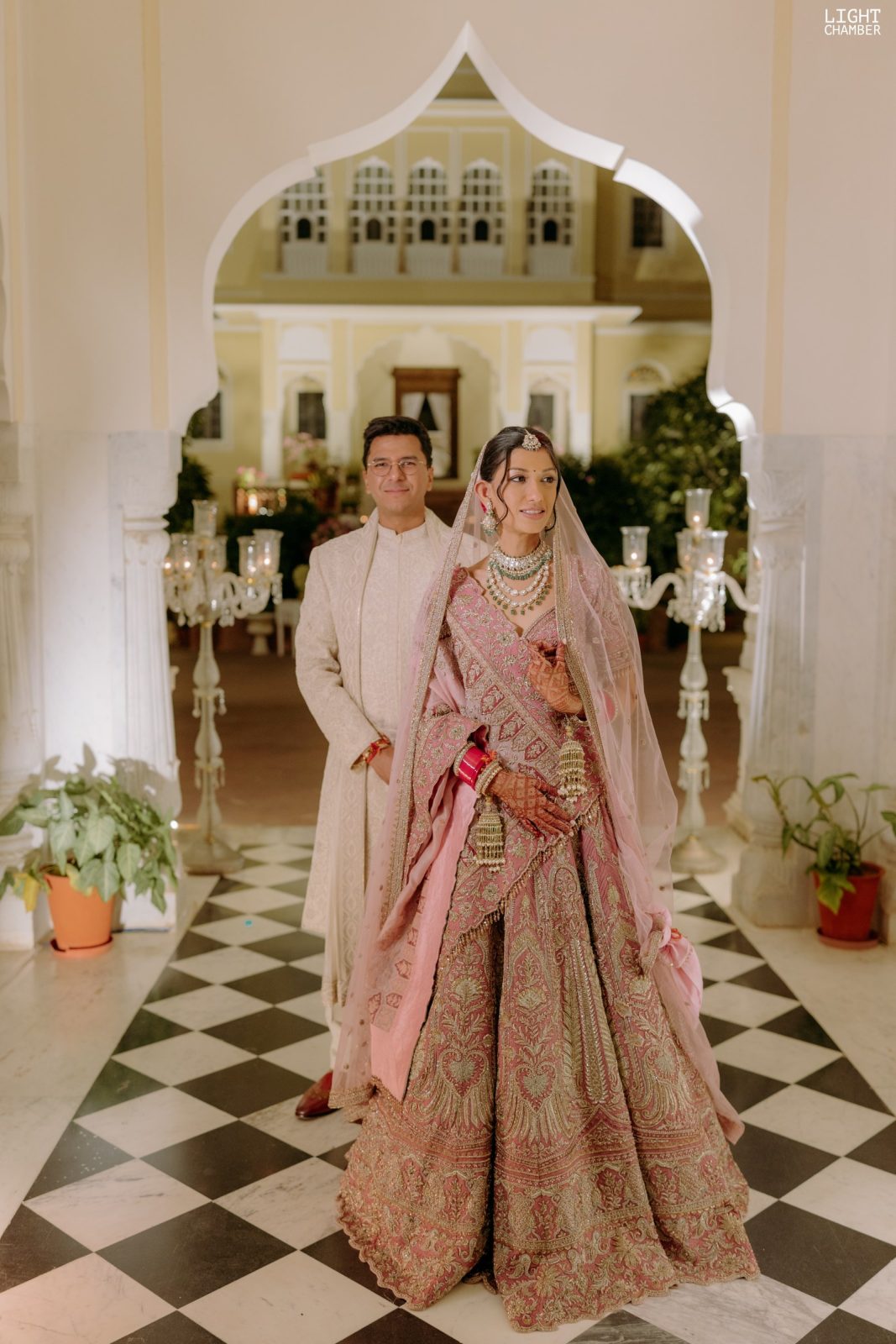 The couple photographed against the architecture of the venue