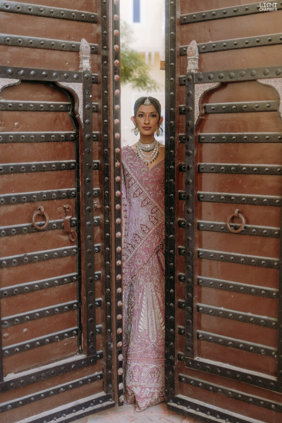 The couple photographed against the architecture of the venue