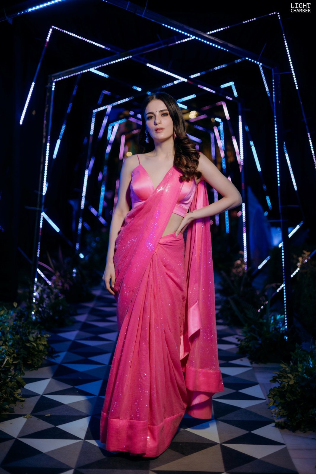 The evening reception — a lit tunnel entry, a ballroom staircase and black-tie guests