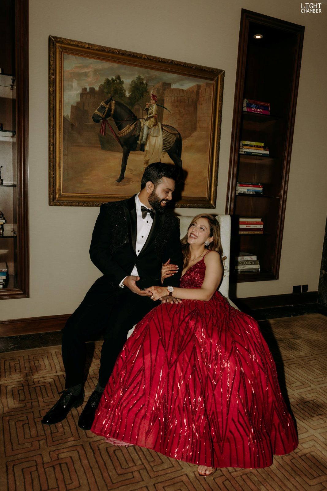 The evening reception — a lit tunnel entry, a ballroom staircase and black-tie guests