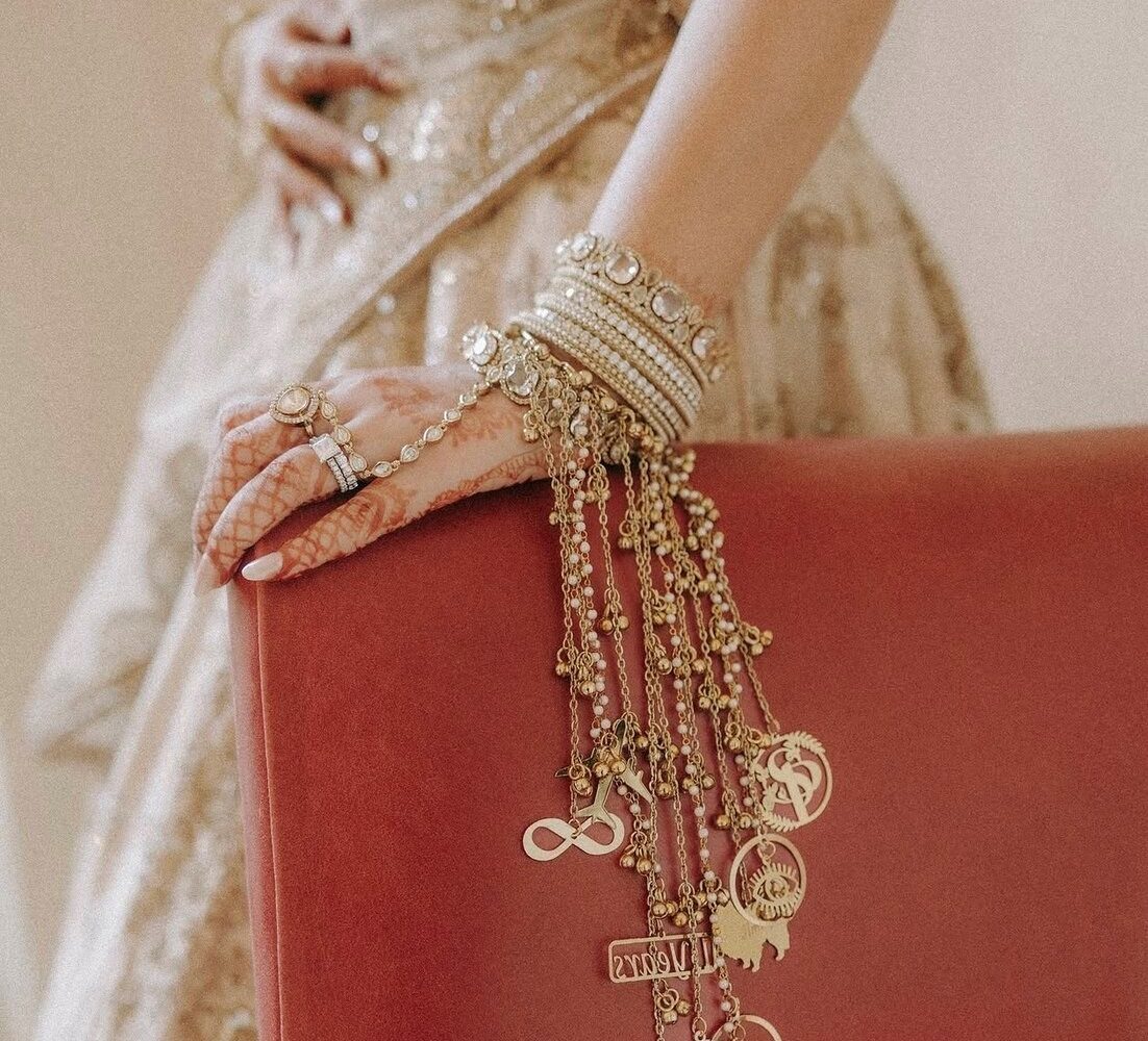 Close detail of the styling — laid tables, stationery, vow books and jewellery