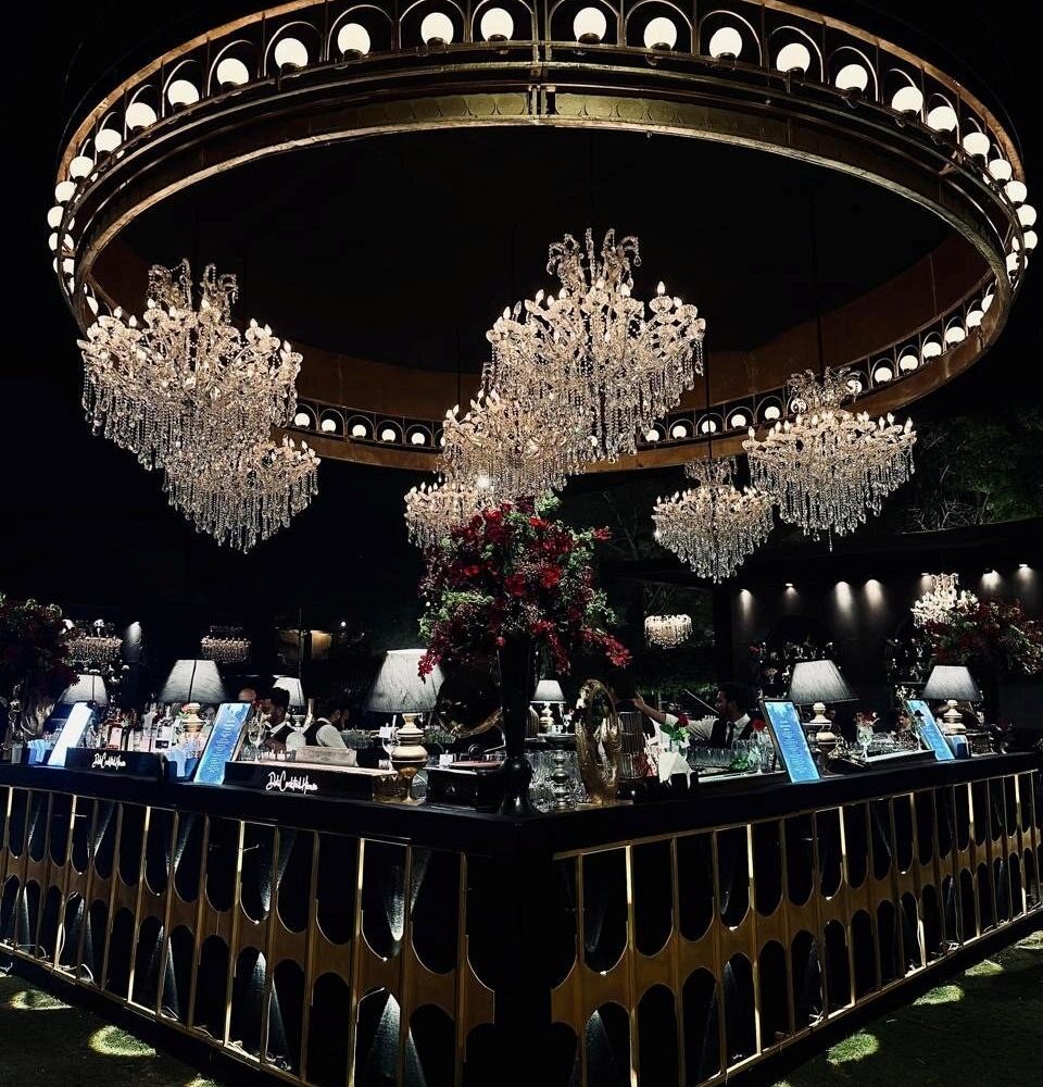 Close detail of the styling — laid tables, stationery, vow books and jewellery